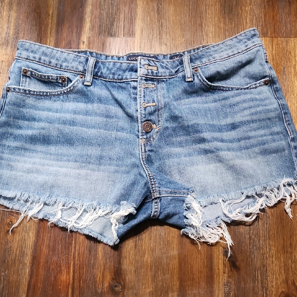 Lucky Brand Blue Frayed Jean Shorts .SIZE 12. waist 17 Flat Rise 9 And Inseam 2